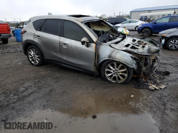 2015 Mazda CX-5 Grand Touring with VIN JM3KE4DY6F0528286, listed as a Copart auction lot 52367765 with Not Provided miles and Salvage Title. Bid and sale history available at DreamBid. Image 4.