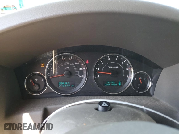 2007 Jeep Commander Sport z VIN 1J8HG48K67C651209, wystawiony jako Copart lot #64049035 z przebiegiem 216 628 mil mil oraz Szkoda całkowita • Salvage title. Historia ofert i sprzedaży dostępna na DreamBid. Obrazek 9.