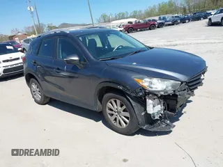 2016 Mazda CX-5 Sport with VIN JM3KE2BY2G0781565, listed as a IAAI auction lot 42042256 with 182,186 mi miles. Bid and sale history available at carsss.com. Image 1.