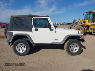 2005 Jeep Wrangler Sport with VIN 1J4FA49SX5P336380, listed as a IAAI auction lot 41752554 with 139,004 mi miles. Bid and sale history available at carsss.com. Image 13.