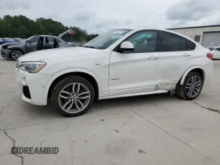 2015 BMW X4 xDrive35i with VIN 5UXXW5C55F0E88843, listed as a Copart auction lot 58946215 with 126,410 mi miles and Salvage title. Bid and sale history available at DreamBid. Image 1.