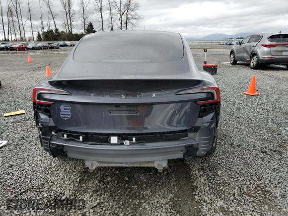 2025 Tesla Model 3 Long Range with VIN 5YJ3E1EA5SF889727, listed as a Copart auction lot 49207545 with 6,980 mi miles and Salvage Title. Bid and sale history available at carsss.com. Image 6.