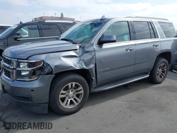 2018 Chevrolet Tahoe LS with VIN 1GNSCAEC2JR306131, listed as a IAAI auction lot 42338873 with 107,652 mi miles and . Bid and sale history available at DreamBid. Image 17.