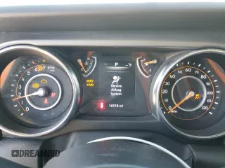 2023 Jeep Wrangler Sport S with VIN 1C4HJXDG5PW623797, listed as a Copart auction lot 66359625 with 16,518 mi miles and Salvage title. Bid and sale history available at DreamBid. Image 9.