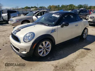2014 MINI Coupe S z VIN WMWSX3C54ET772839, wystawiony jako Copart lot #73992794 z przebiegiem 100 580 mil mil oraz Nie do naprawy. Historia ofert i sprzedaży dostępna na DreamBid. Obrazek 1.