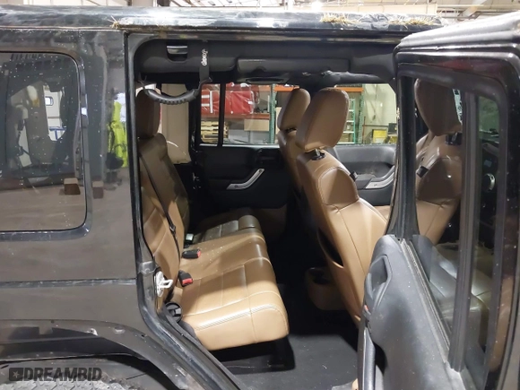 2011 Jeep Wrangler Unlimited Sahara with VIN 1J4HA5H12BL557059, listed as a IAAI auction lot 41856882 with 150,683 mi miles. Bid and sale history available at carsss.com. Image 8.