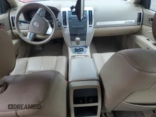 2009 Cadillac STS AWD z VIN 1G6DA67V190100207, wystawiony jako Copart lot #58911305 z przebiegiem Nie podano mil oraz Szkoda całkowita • Salvage title. Historia ofert i sprzedaży dostępna na DreamBid. Obrazek 8.