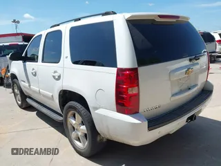 2007 Chevrolet Tahoe LS with VIN 1GNFC13007R310861, listed as a IAAI auction lot 42621401 with 241,291 mi miles and . Bid and sale history available at DreamBid. Image 3.