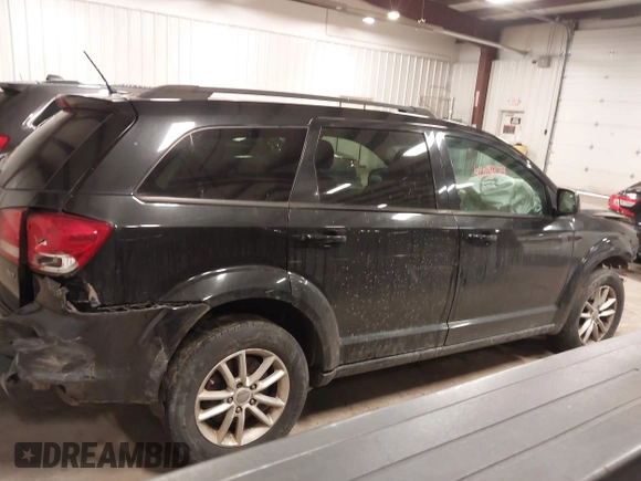 2013 Dodge Journey SXT with VIN 3C4PDDBGXDT571489, listed as a IAAI auction lot 42015939 with 206,550 mi miles and . Bid and sale history available at DreamBid. Image 13.