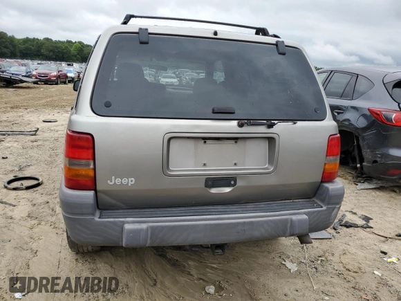 1998 Jeep Grand Cherokee Laredo with VIN 1J4FX58S7WC350624, listed as a Copart auction lot 63063624 with 0 mi miles and Salvage Title. Bid and sale history available at carsss.com. Image 6.