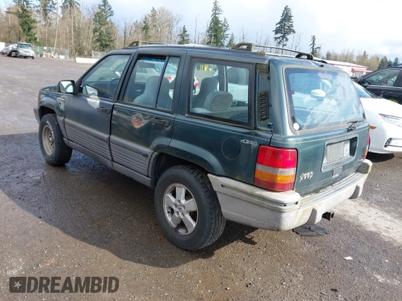 1995 Jeep Grand Cherokee Laredo with VIN 1J4GZ58SXSC676393, listed as a IAAI auction lot 41943464 with 244,317 mi miles. Bid and sale history available at carsss.com. Image 3.