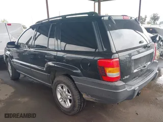 2004 Jeep Grand Cherokee Laredo with VIN 1J4GX48N94C435700, listed as a IAAI auction lot 41809624 with 147,413 mi miles. Bid and sale history available at carsss.com. Image 3.