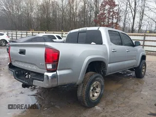 2018 Toyota Tacoma SR with VIN 3TMCZ5AN4JM148581, listed as a IAAI auction lot 41462945 with 115,655 mi miles. Bid and sale history available at carsss.com. Image 4.