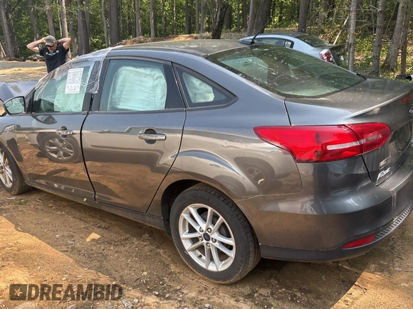 2017 Ford Focus SE with VIN 1FADP3F23HL200927, listed as a Copart auction lot 60996055 with Not provided miles and Clean title. Bid and sale history available at DreamBid. Image 3.