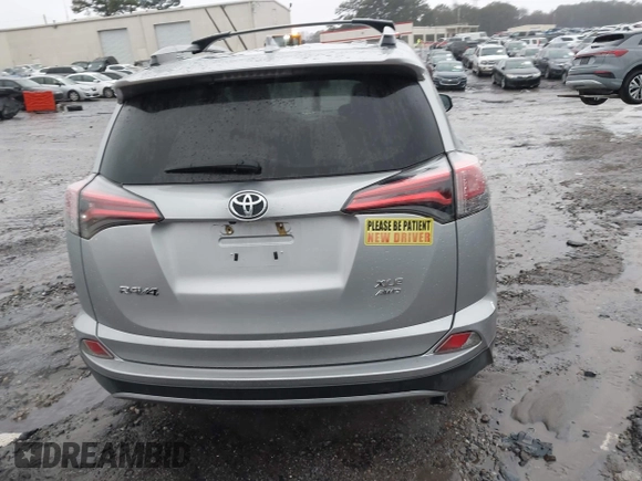 2018 Toyota RAV4 XLE with VIN 2T3RFREV2JW717351, listed as a IAAI auction lot 41576522 with 147,116 mi miles. Bid and sale history available at carsss.com. Image 16.