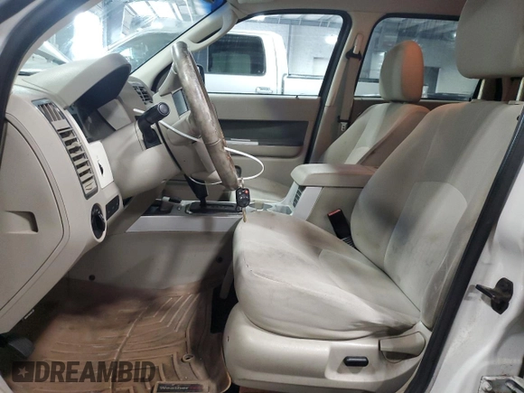2009 Mercury Mariner Hybrid with VIN 4M2CU29339KJ14631, listed as a Copart auction lot 71823674 with 190,853 mi miles and Salvage title. Bid and sale history available at DreamBid. Image 7.