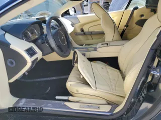2015 Aston Martin DB9 z VIN SCFFDAFM3FGB16585, wystawiony jako Copart lot #76159354 z przebiegiem Nie podano mil oraz Szkody całkowita. Historia ofert i sprzedaży dostępna na DreamBid. Obrazek 7.