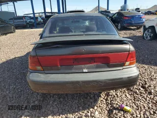1999 Saturn SL with VIN 1G8ZK527XXZ136922, listed as a Copart auction lot 86704404 with 134,897 mi miles and Salvage Title. Bid and sale history available at carsss.com. Image 6.