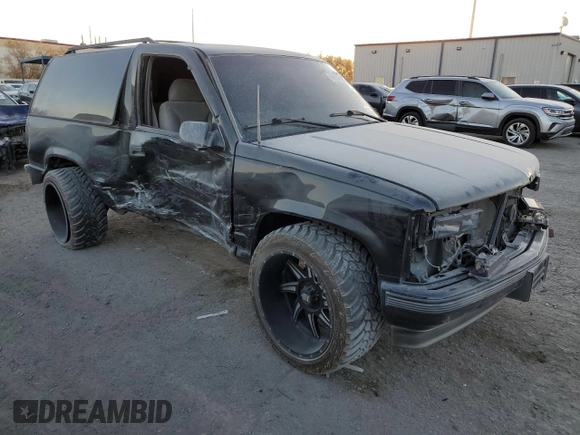 1999 Chevrolet Tahoe with VIN 3GNEC18R1XG143882, listed as a Copart auction lot 42177005 with 130,368 mi miles and Salvage title. Bid and sale history available at DreamBid. Image 4.