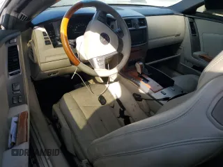 2006 Cadillac XLR z VIN 1G6YV36AX65603381, wystawiony jako Copart lot #77526894 z przebiegiem Nie podano mil oraz Nie do naprawy. Historia ofert i sprzedaży dostępna na DreamBid. Obrazek 8.