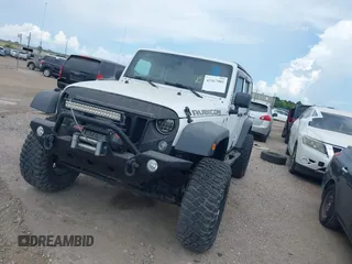 2011 Jeep Wrangler Unlimited Rubicon with VIN 1J4BA6H10BL536027, listed as a IAAI auction lot 42567901 with 164,487 mi miles and . Bid and sale history available at DreamBid. Image 2.