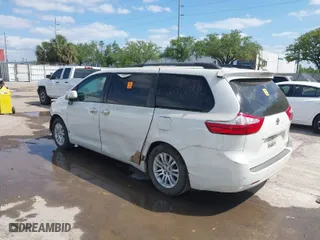 2015 Toyota Sienna XLE with VIN 5TDYK3DC8FS566058, listed as a IAAI auction lot 41908422 with 215,503 mi miles. Bid and sale history available at carsss.com. Image 3.