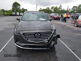 2016 Mazda CX-9 Grand Touring z VIN JM3TCADY6G0126391, wystawiony jako IAAI lot #42242541 z przebiegiem 45 147 mil mil oraz . Historia ofert i sprzedaży dostępna na DreamBid. Obrazek 12.