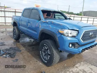 2019 Toyota Tacoma SR z VIN 3TMCZ5AN7KM252435, wystawiony jako IAAI lot #42115324 z przebiegiem 55 399 mil mil oraz . Historia ofert i sprzedaży dostępna na DreamBid. Obrazek 1.
