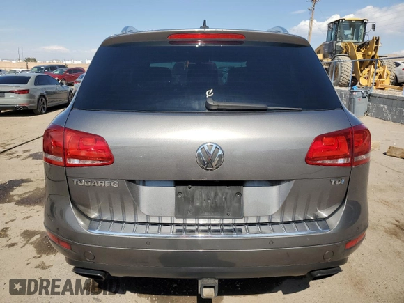 2013 Volkswagen Touareg Sport с VIN WVGEP9BP0DD010408, выставлен на аукционе Copart как лот 75854084 с пробегом 159 863 миль миль и Списание • Salvage title. История ставок и продаж доступна на DreamBid. Изображение 6.