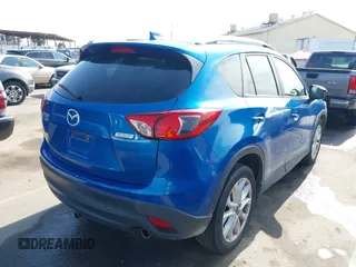 2014 Mazda CX-5 Grand Touring with VIN JM3KE4DY1E0327703, listed as a IAAI auction lot 41755735 with 206,845 mi miles. Bid and sale history available at carsss.com. Image 4.