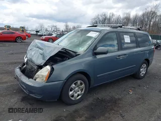 2009 Kia Sedona LX with VIN KNDMB233696299758, listed as a IAAI auction lot 41929906 with 214,445 mi miles. Bid and sale history available at carsss.com. Image 2.