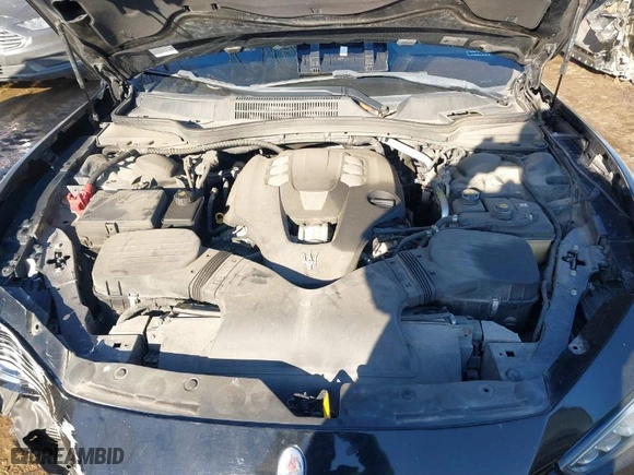 2014 Maserati Ghibli with VIN ZAM57XSA4E1090315, listed as a IAAI auction lot 41423507 with 115,323 mi miles. Bid and sale history available at carsss.com. Image 10.