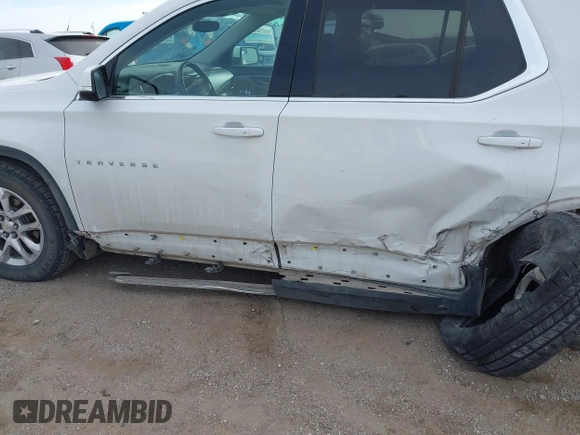 2018 Chevrolet Traverse LT Cloth z VIN 1GNEVGKW8JJ167095, wystawiony jako IAAI lot #41479356 z przebiegiem 98 615 mil mil oraz . Historia ofert i sprzedaży dostępna na DreamBid. Obrazek 18.