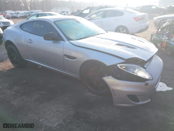 2014 Jaguar XK with VIN SAJWA4DC7EMB52199, listed as a IAAI auction lot 41191119 with 90,585 mi miles. Bid and sale history available at carsss.com. Image 1.