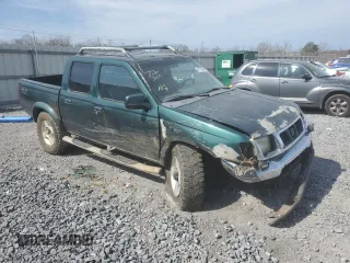 2000 Nissan Frontier XE with VIN 1N6ED27Y4YC382199, listed as a Copart auction lot 47127045 with 207,449 mi miles and Salvage title. Bid and sale history available at DreamBid. Image 4.