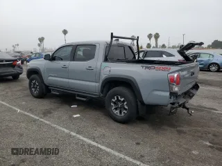 2021 Toyota Tacoma SR with VIN 3TMCZ5AN4MM402889, listed as a Copart auction lot 59942695 with 61,504 mi miles and Salvage title. Bid and sale history available at DreamBid. Image 2.