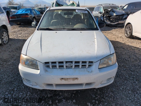2000 Hyundai Accent z VIN KMHCG45G0YU084004, wystawiony jako Copart lot #42980585 z przebiegiem 167 545 mil mil oraz Czysty tytuł • Clean title. Historia ofert i sprzedaży dostępna na DreamBid. Obrazek 5.