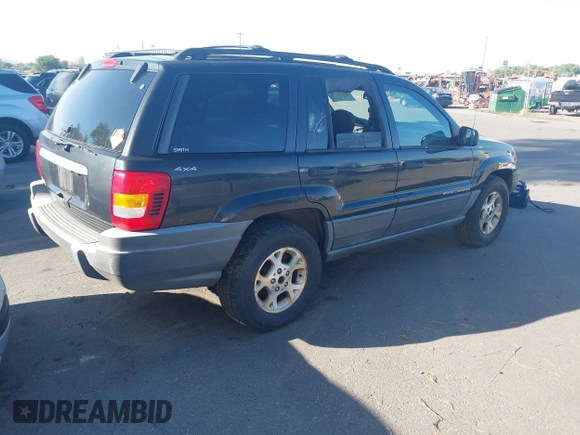 1999 Jeep Grand Cherokee Laredo with VIN 1J4GW58S0XC538913, listed as a IAAI auction lot 42684467 with 241,252 mi miles and . Bid and sale history available at DreamBid. Image 4.