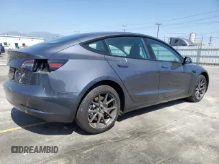 2023 Tesla Model 3 with VIN 5YJ3E1EA3PF695267, listed as a Copart auction lot 52559645 with 9,025 mi miles and Salvage title. Bid and sale history available at DreamBid. Image 3.