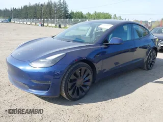 2023 Tesla Model 3 Performance with VIN 5YJ3E1EC2PF679613, listed as a IAAI auction lot 42099199 with 21,721 mi miles. Bid and sale history available at carsss.com. Image 2.