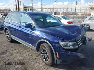 2021 Volkswagen Tiguan SE with VIN 3VV3B7AX9MM051125, listed as a IAAI auction lot 41527014 with 68,847 mi miles and . Bid and sale history available at DreamBid. Image 1.