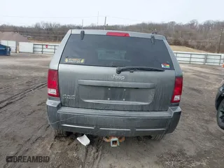 2007 Jeep Grand Cherokee Laredo with VIN 1J8GR48K57C556517, listed as a IAAI auction lot 41534166 with 158,914 mi miles. Bid and sale history available at carsss.com. Image 16.
