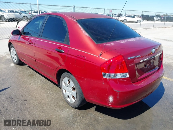 2009 Kia Spectra EX with VIN KNAFE221195606045, listed as a IAAI auction lot 41764519 with 124,577 mi miles. Bid and sale history available at carsss.com. Image 3.