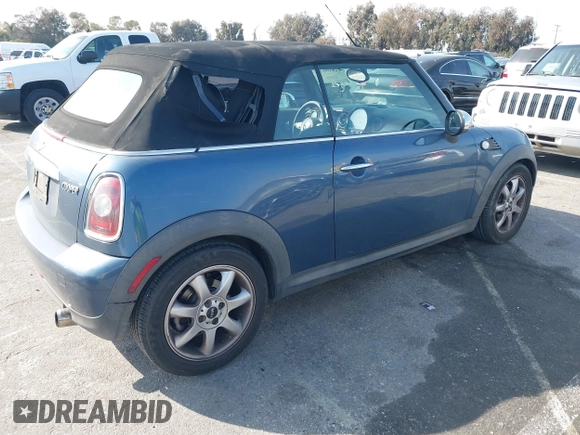 2010 MINI Convertible with VIN WMWMR3C53ATU97865, listed as a IAAI auction lot 41610670 with 154,457 mi miles and . Bid and sale history available at DreamBid. Image 4.
