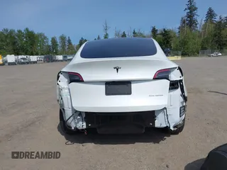 2023 Tesla Model Y Long Range with VIN 7SAYGDEE4PF676167, listed as a IAAI auction lot 42147909 with 20,488 mi miles. Bid and sale history available at carsss.com. Image 17.
