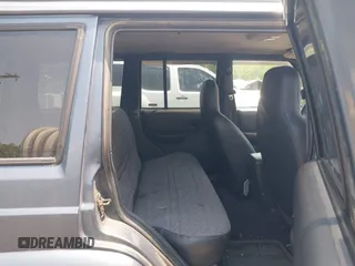 2001 Jeep Cherokee Sport z VIN 1J4FF48S51L531033, wystawiony jako IAAI lot #42423910 z przebiegiem 90 438 mil mil oraz . Historia ofert i sprzedaży dostępna na DreamBid. Obrazek 8.