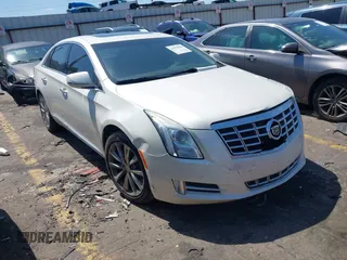 2014 Cadillac XTS Luxury z VIN 2G61M5S32E9310910, wystawiony jako IAAI lot #41978298 z przebiegiem Nie podano mil oraz . Historia ofert i sprzedaży dostępna na DreamBid. Obrazek 1.