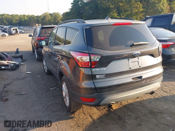 2018 Ford Escape SEL with VIN 1FMCU9HD0JUC25036, listed as a IAAI auction lot 40518589 with 143,076 mi miles. Bid and sale history available at carsss.com. Image 3.