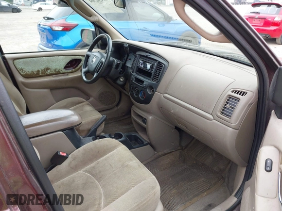 2001 Mazda Tribute LX with VIN 4F2CU08141KM10269, listed as a IAAI auction lot 42138704 with 166,825 mi miles and . Bid and sale history available at carsss.com. Image 5.