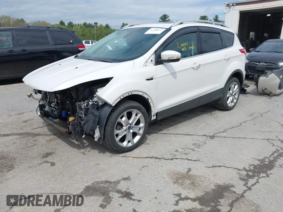 2016 Ford Escape Titanium with VIN 1FMCU9J98GUA00832, listed as a IAAI auction lot 42188941 with 90,764 mi miles and . Bid and sale history available at DreamBid. Image 2.